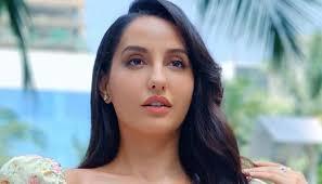 Glamorous look of Nora Fatehi seen in off white saree.