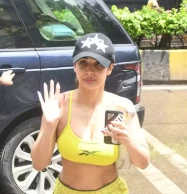 Amid speculation of a split from Arjun Kapoor, Malaika Arora opts for a plunging sports bra and neon shorts for her gym session.