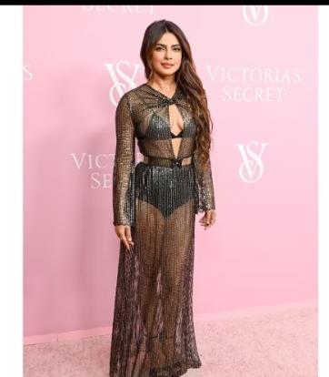 Priyanka Chopra dazzled on the pink carpet, showcasing her toned figure in a stunning black transparent outfit.