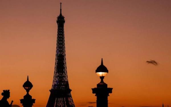 The Eiffel Tower's lights dim as a tribute to victims of the Morocco earthquake.