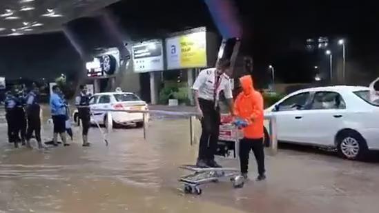 Pilot enters Jaipur airport on luggage cart amid flooding, video goes viral.