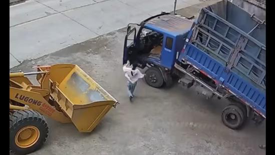 Woman prevents disaster by stopping unmanned moving truck. 