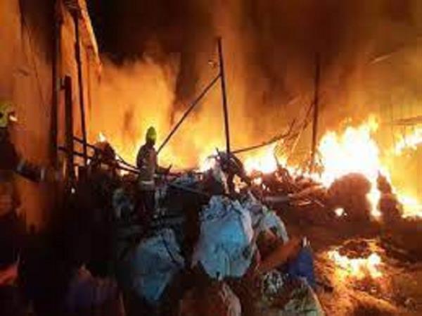 A fire erupts at huts in the Thane district of Maharashtra.